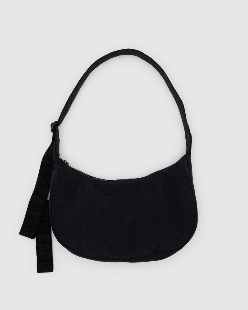 BAGGU Crossbody Bags A black nylon crescent-shaped handbag with an adjustable strap and a small logo on the exterior.